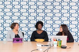 Three counselors at a desk discuss their counselling practices in this photo. Our courses will keep you up to date on being the best professional you can be.